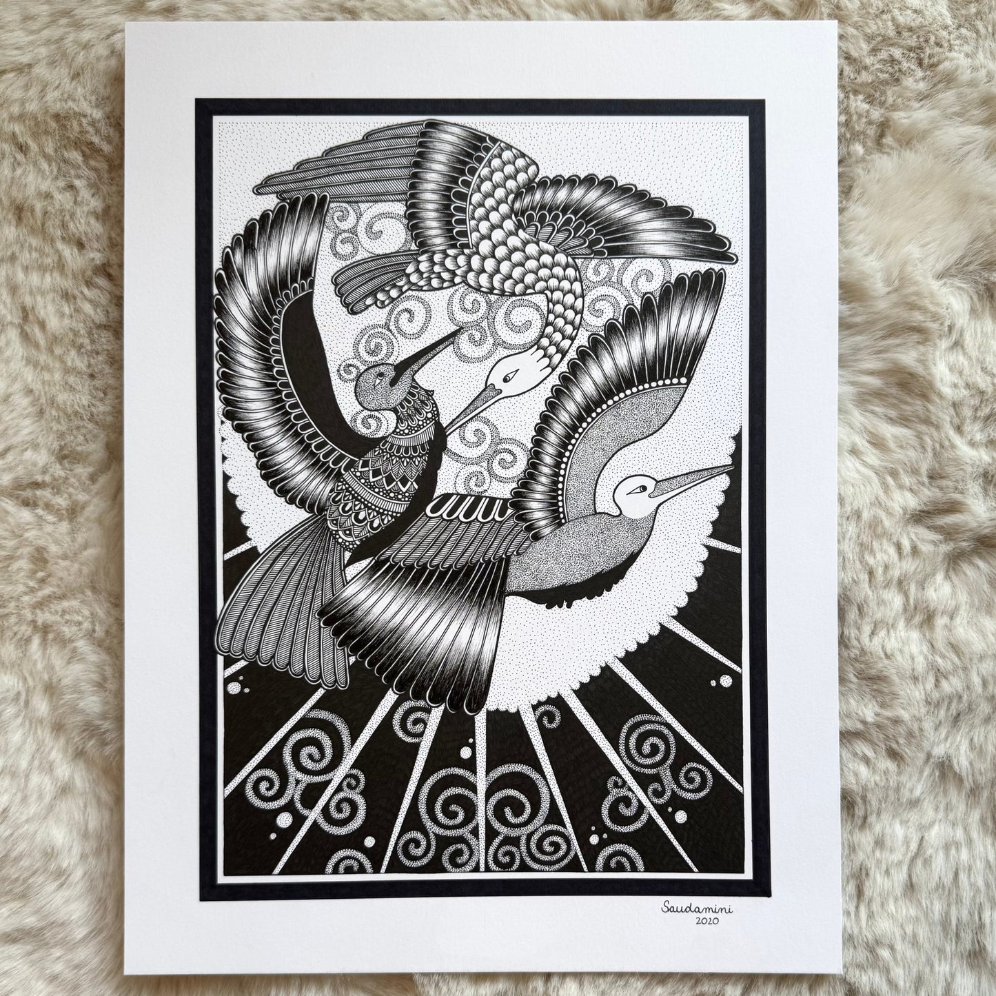 Hand-drawn zentangle artwork by Saudamini Madra, two cranes in flight with fine feather detail in black ink on Bristol paper