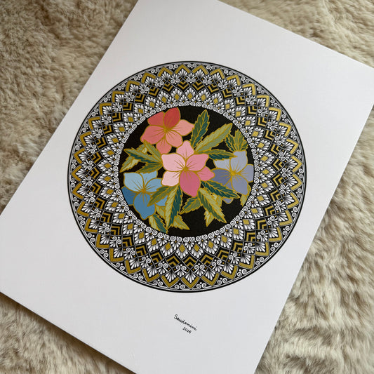 Hand-drawn mandala by Saudamini Madra with pink and blue flowers in ink and color on Bristol paper, photographed on textured surface