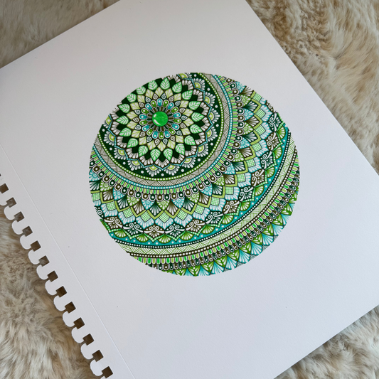 Colorful mandala design, resting on a textured surface