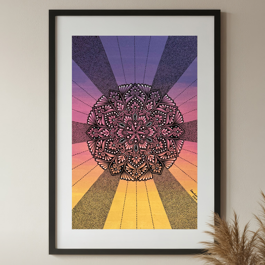Framed mandala art with a colorful radial design on a beige wall.