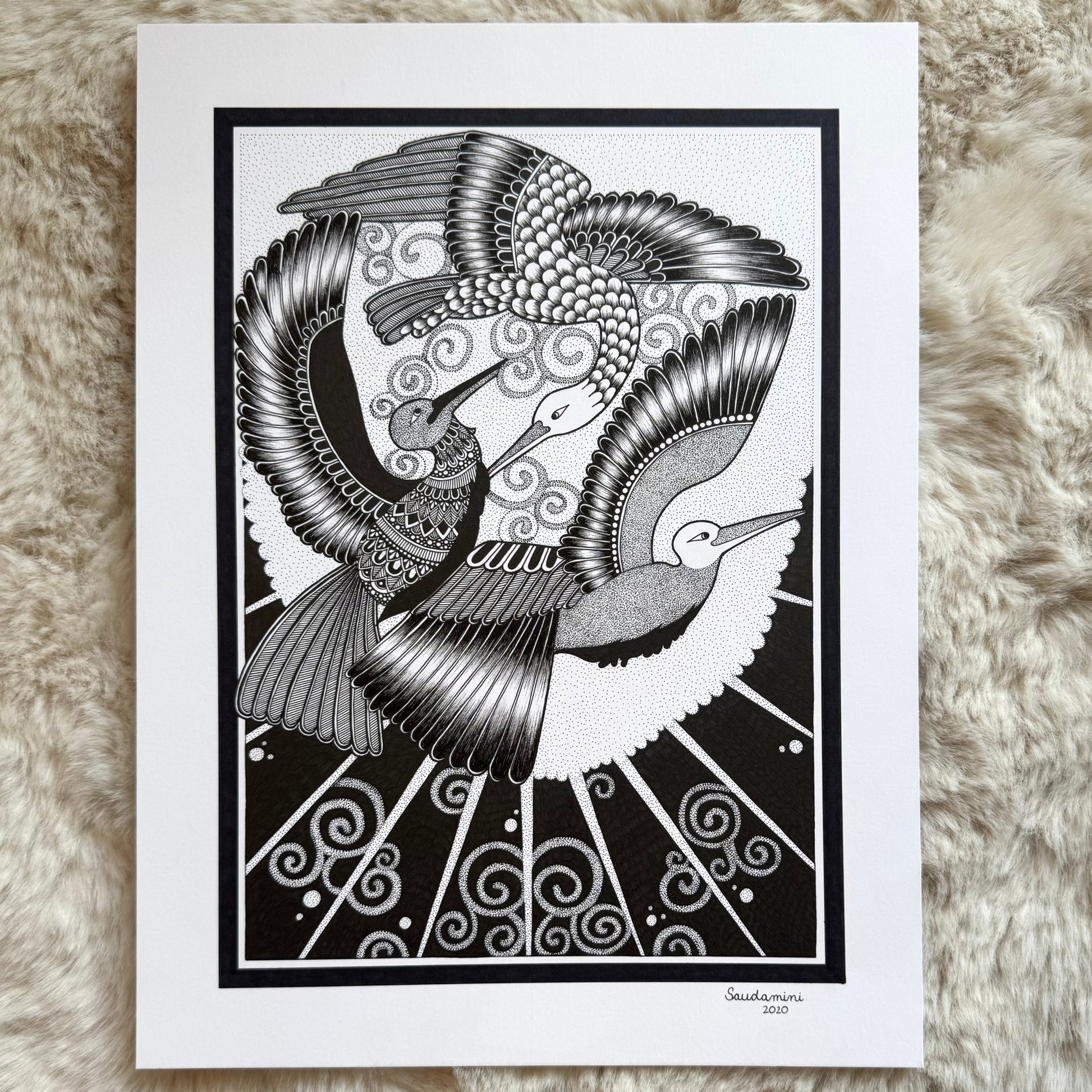 Hand-drawn zentangle artwork by Saudamini Madra, two cranes in flight with fine feather detail in black ink on Bristol paper