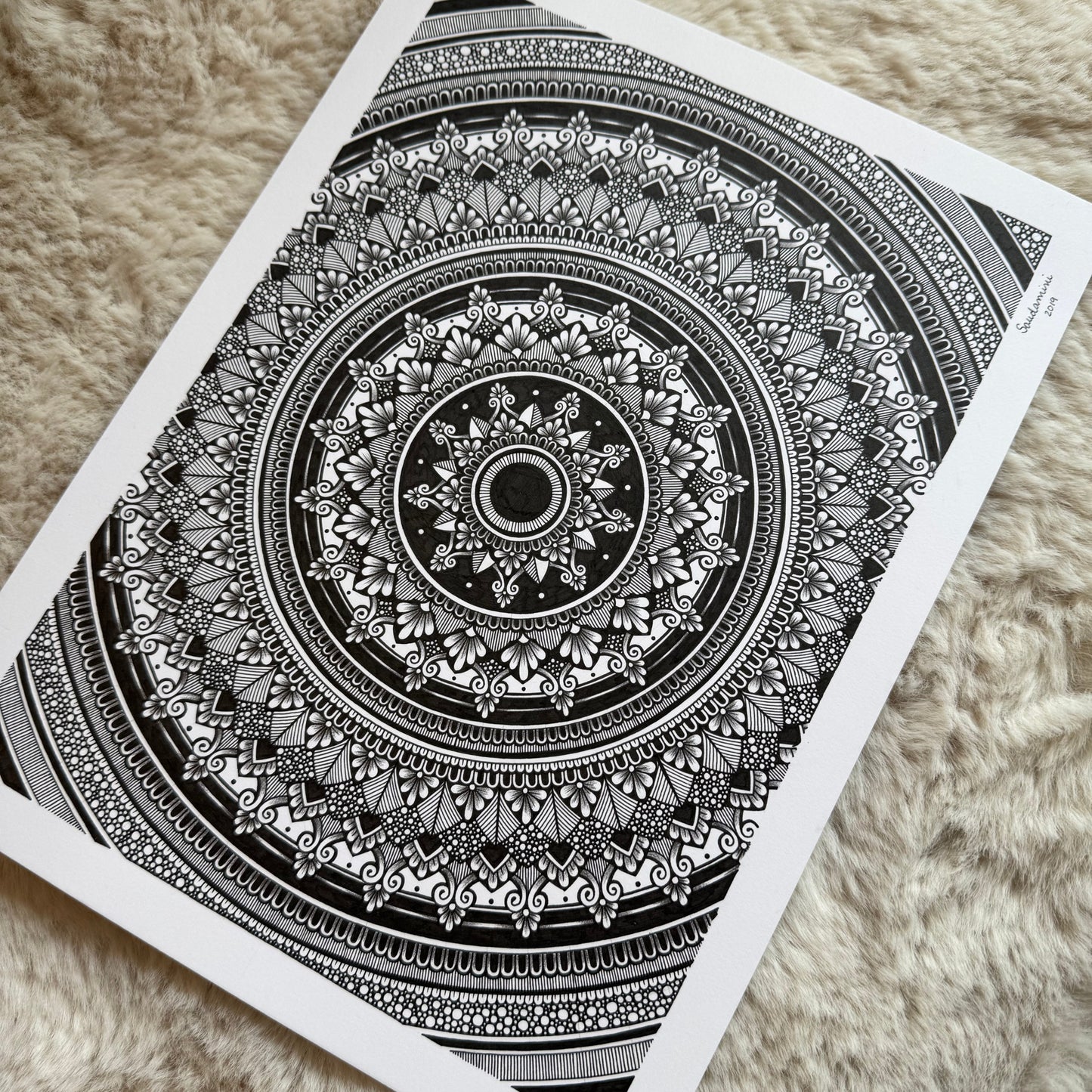 a mandala resting on a textured surface