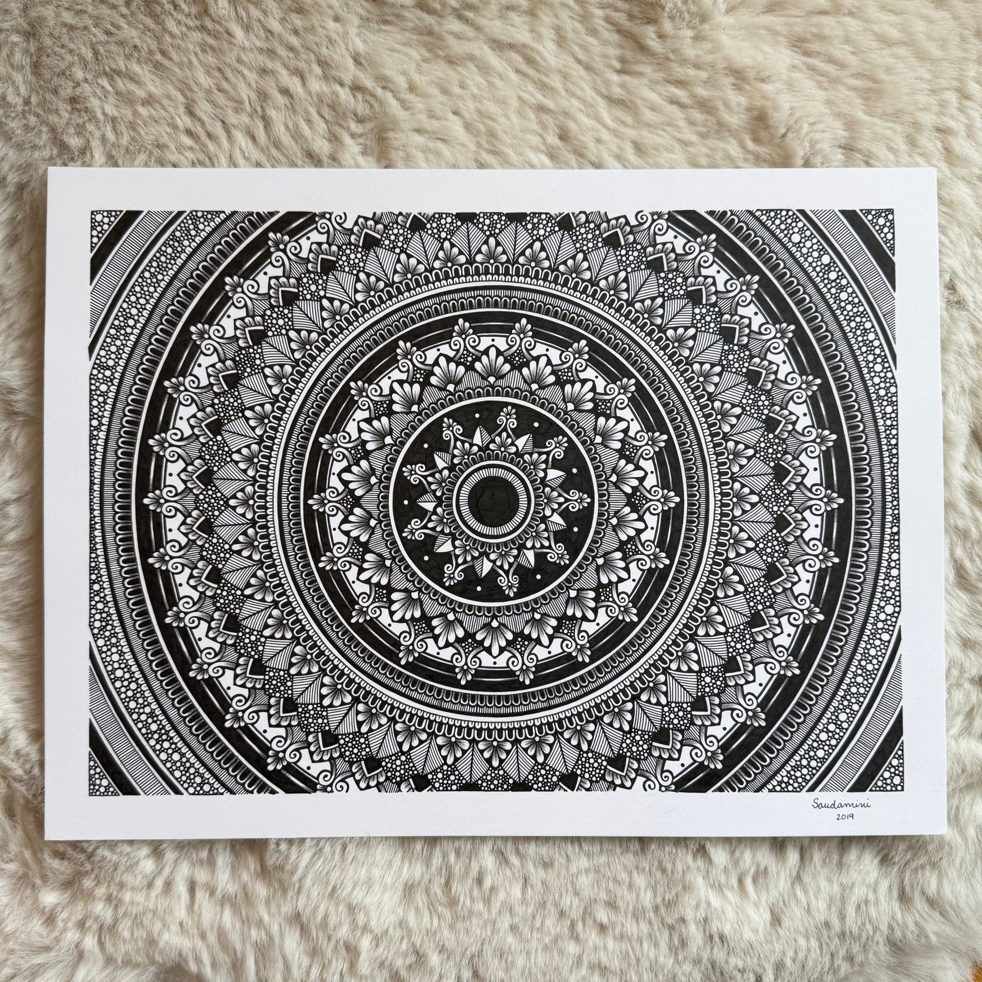 a mandala resting on a textured surface