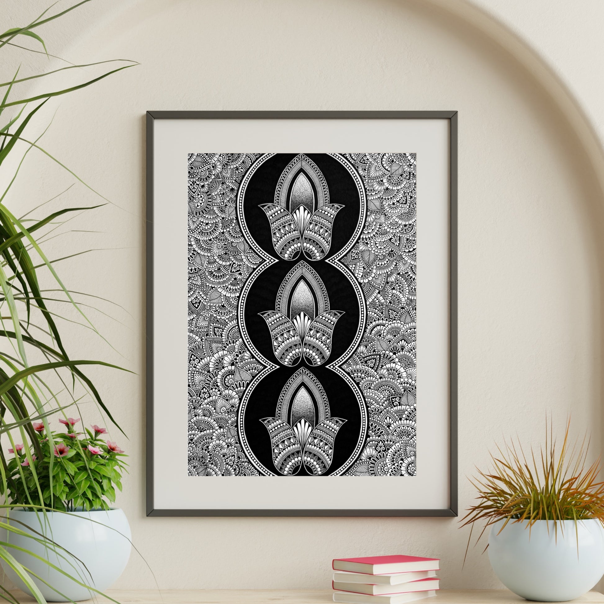 Composite mockup of A Triple Blooming Oath Zentangle by Saudamini Madra, three lotus forms in black ink on Bristol paper, shown framed in a styled room setting