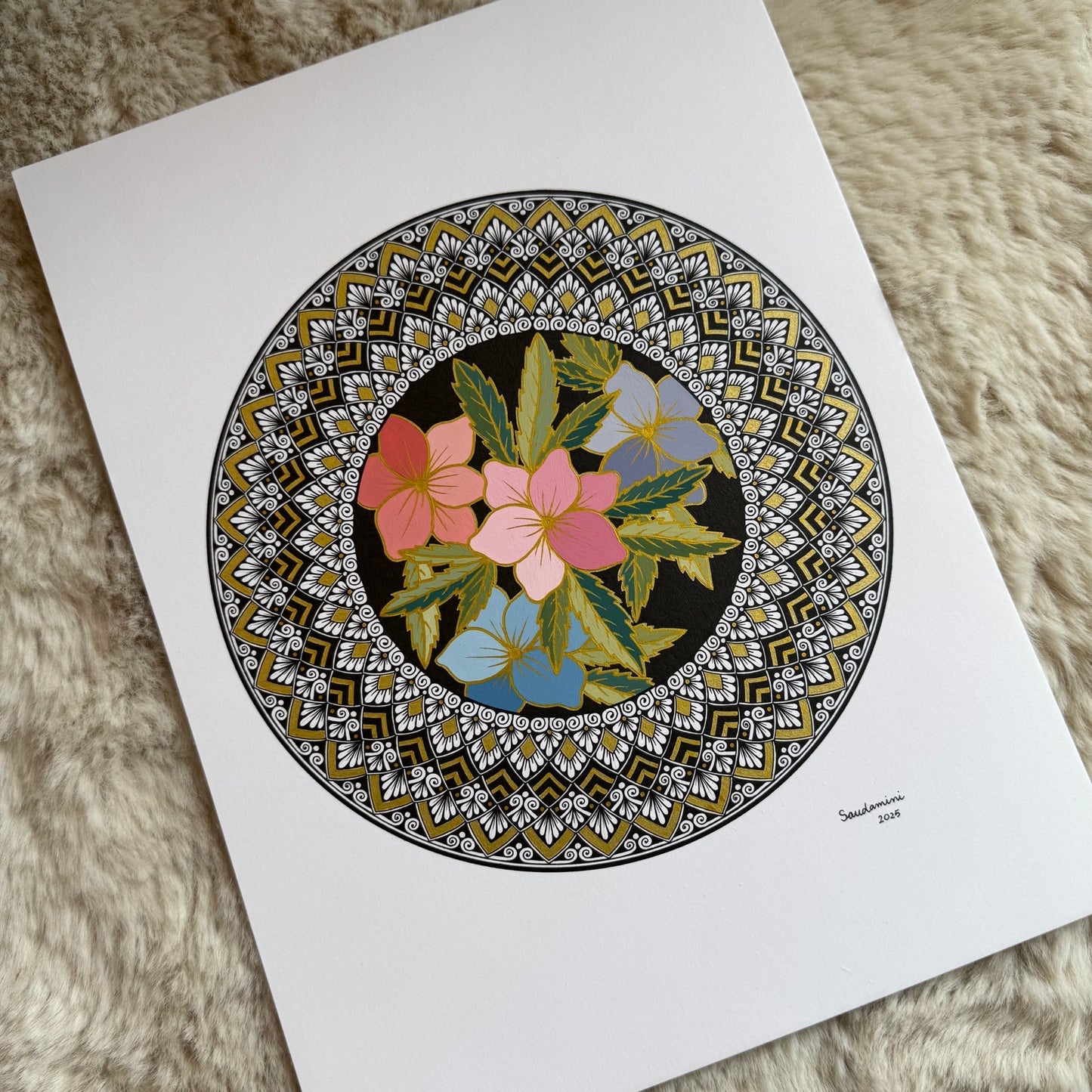 Hand-drawn floral mandala by Saudamini Madra in ink and color on Bristol paper, detail view on textured surface