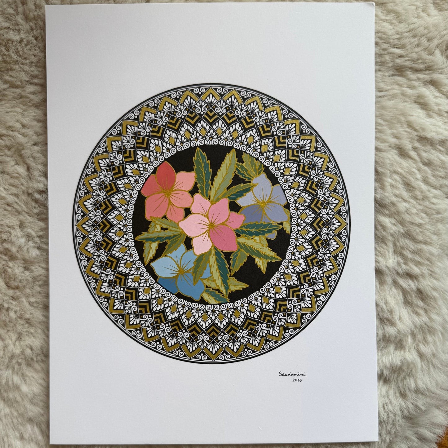 Hand-drawn mandala by Saudamini Madra showing colored blooms in a dark circle, ink on Bristol paper