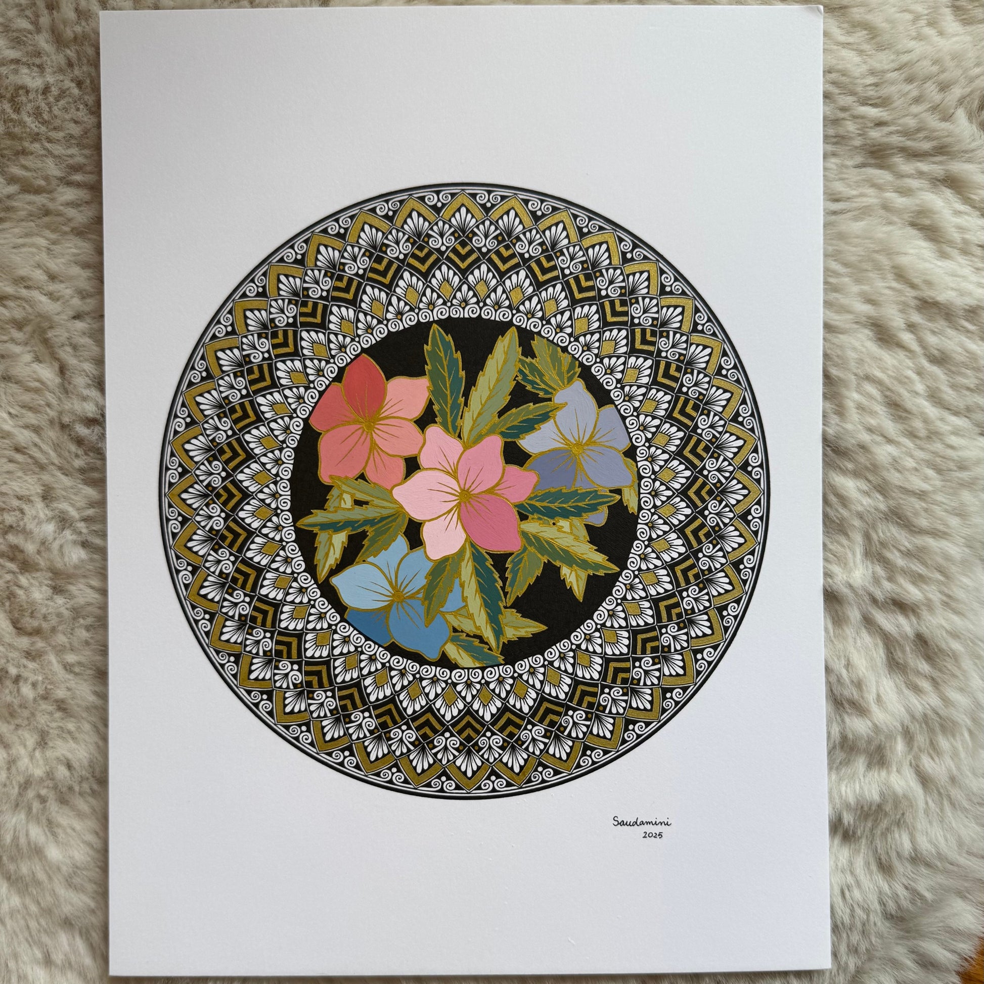 Hand-drawn mandala by Saudamini Madra showing colored blooms in a dark circle, ink on Bristol paper