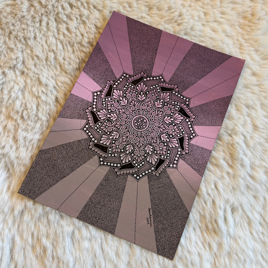 Decorative mandala design on a fluffy white surface