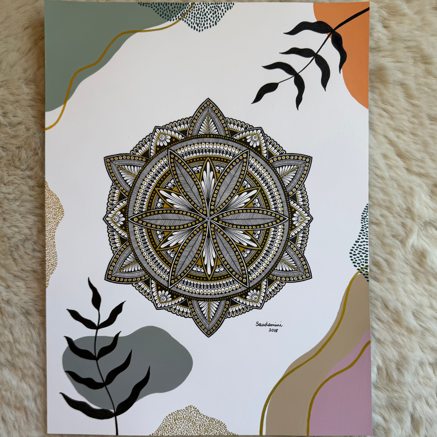 Decorative mandala design and leaf illustrations on a textured surface.