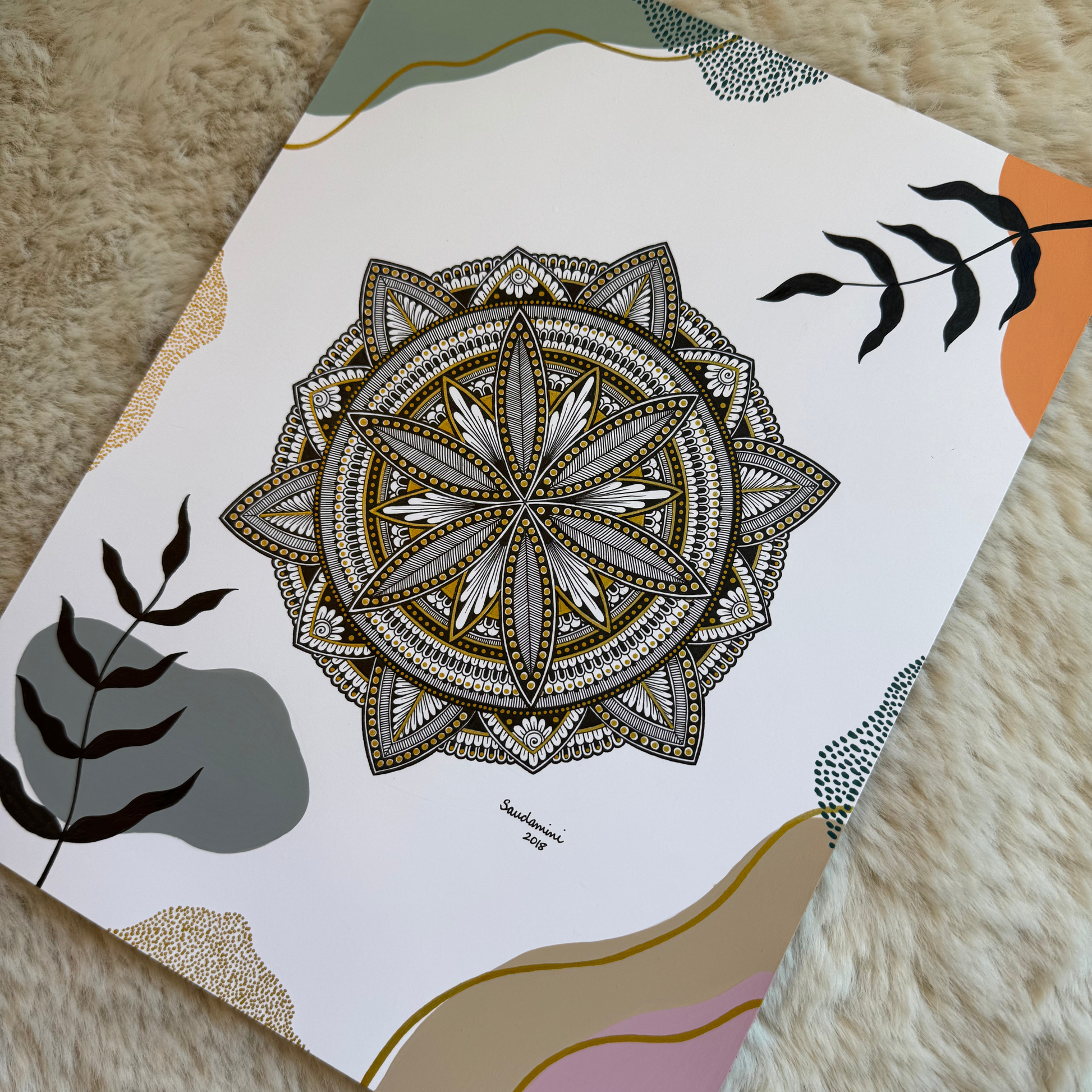 Decorative mandala design and leaf patterns on a textured surface