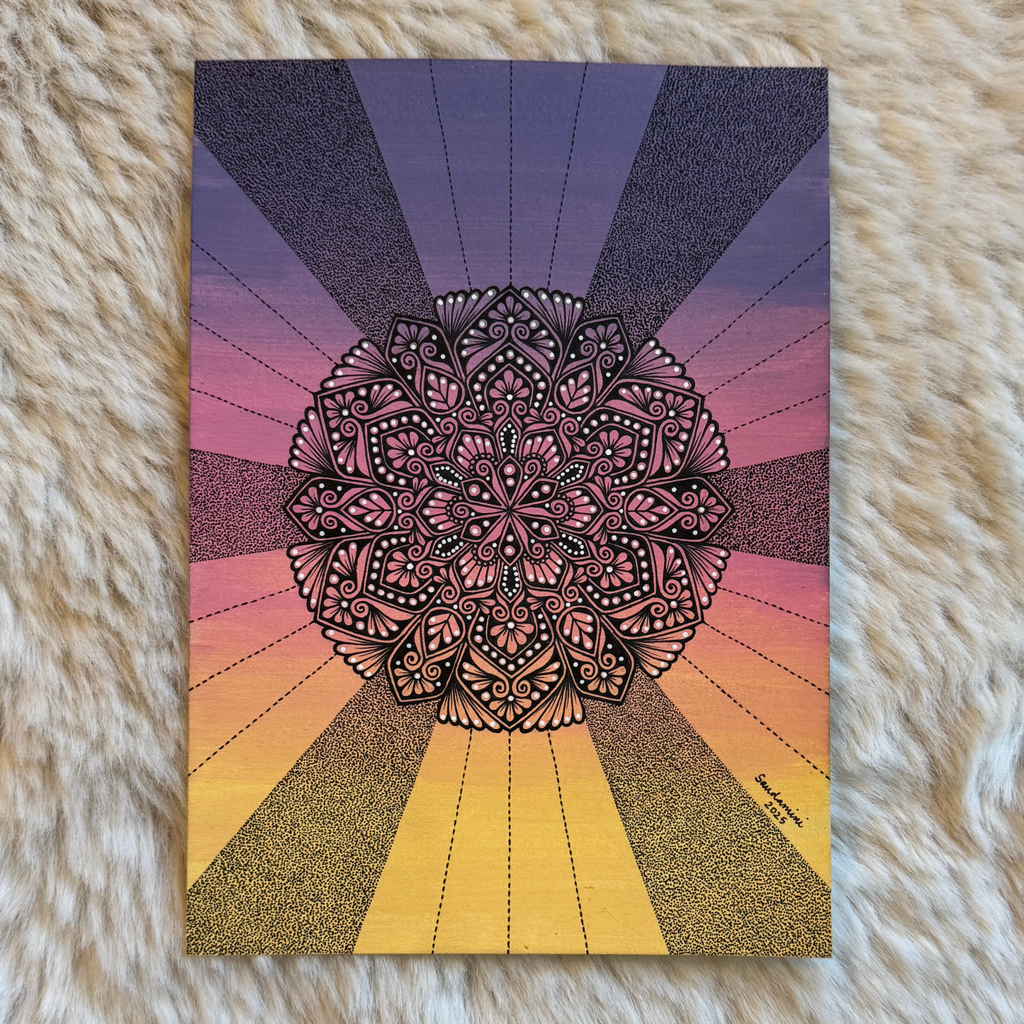 Colorful mandala design on a textured surface