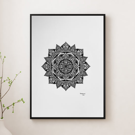 Composite mockup of Petals for an Unspoken Wish Mandala by Saudamini Madra, a circular mandala in black ink on Bristol paper, shown in a black frame on a white wall
