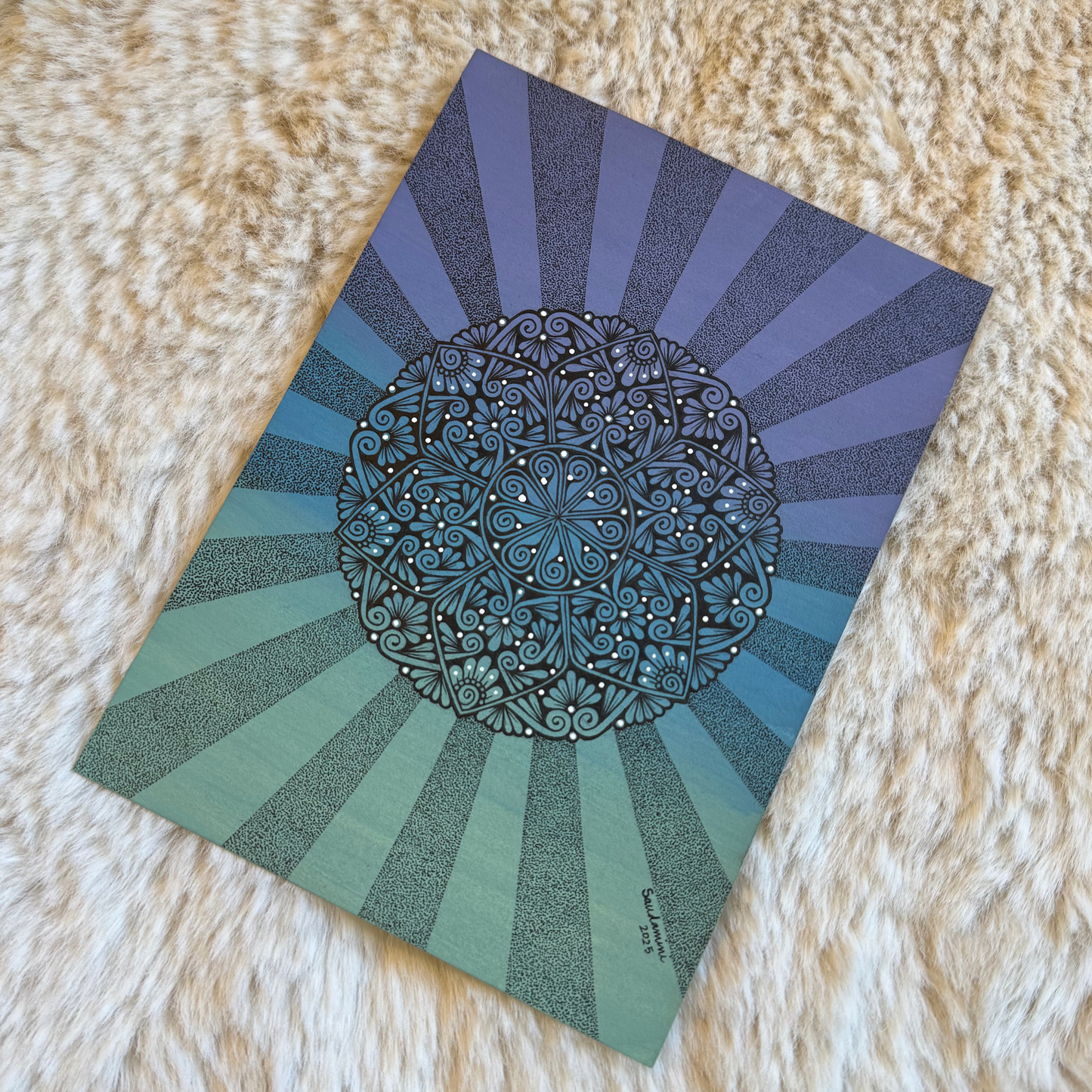 Decorative paper with a mandala design on a textured surface