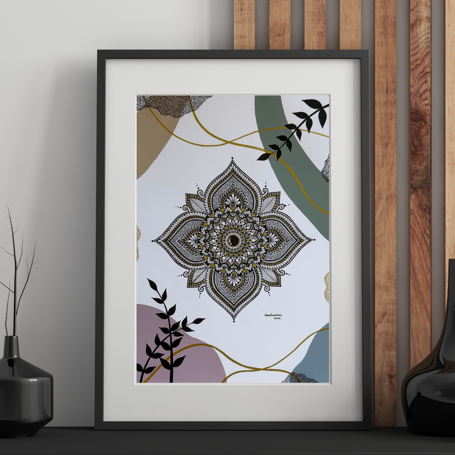 Mandala art print on a wall with minimal decor