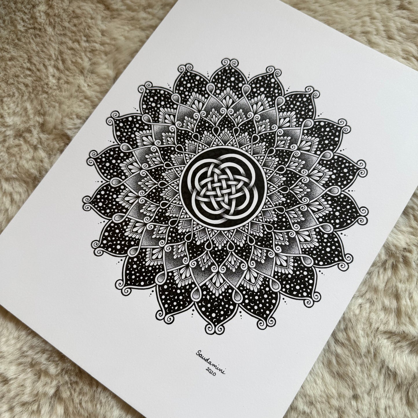 Hand-drawn mandala by Saudamini Madra in black ink on Bristol paper, detail view of petal and leaf patterning