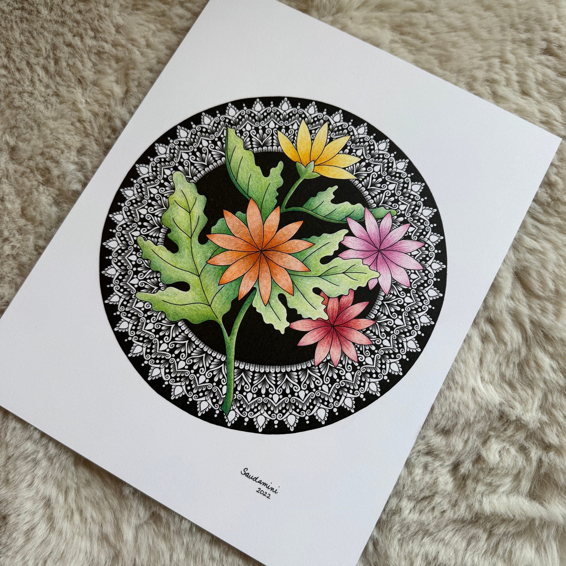 Hand-drawn mandala by Saudamini Madra showing colorful daisy forms in ink on Bristol paper, detail view