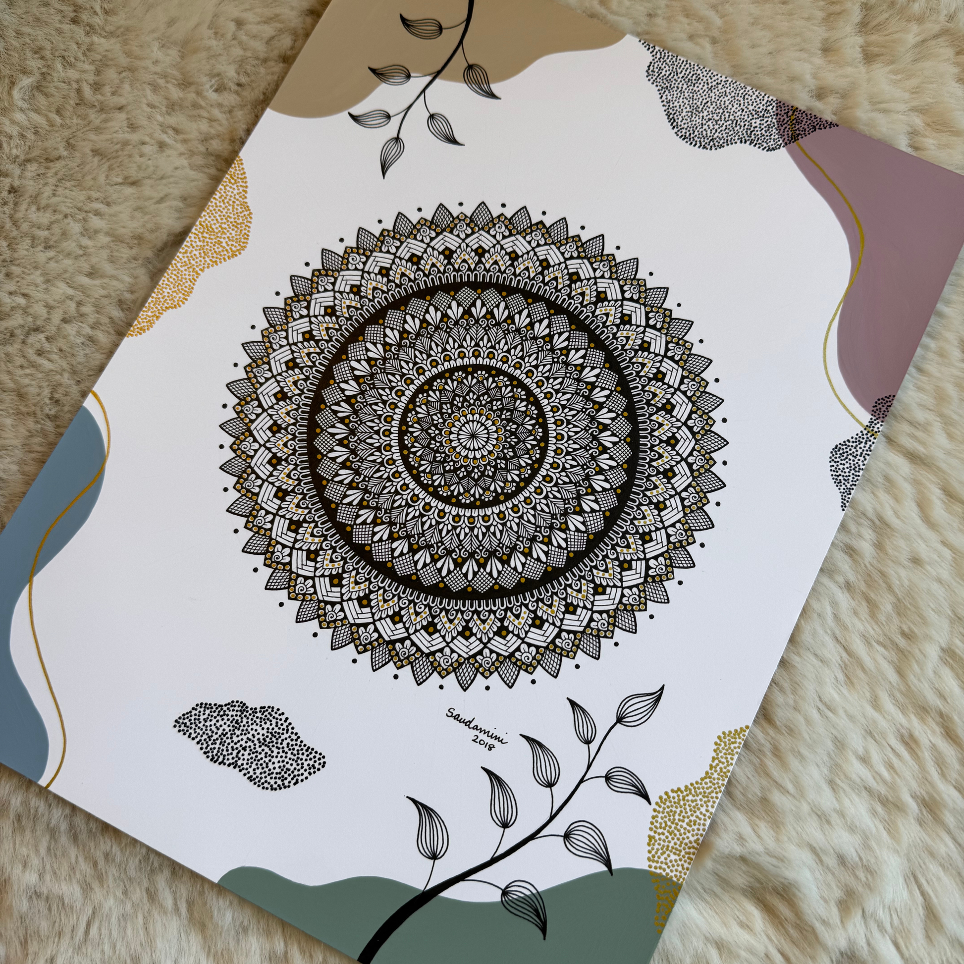 Paper with mandala design on a textured surface
