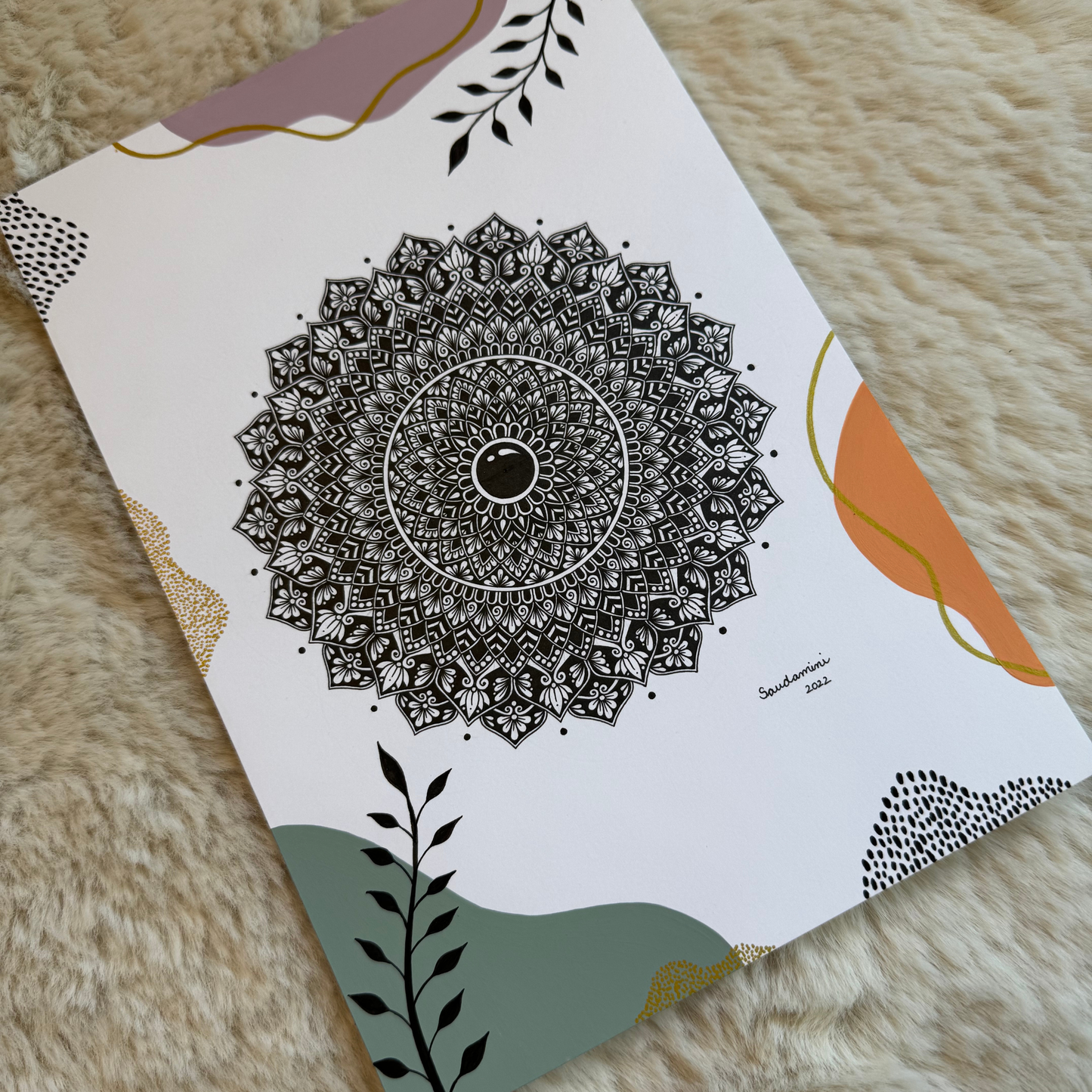 Decorative paper with mandala design on a textured surface