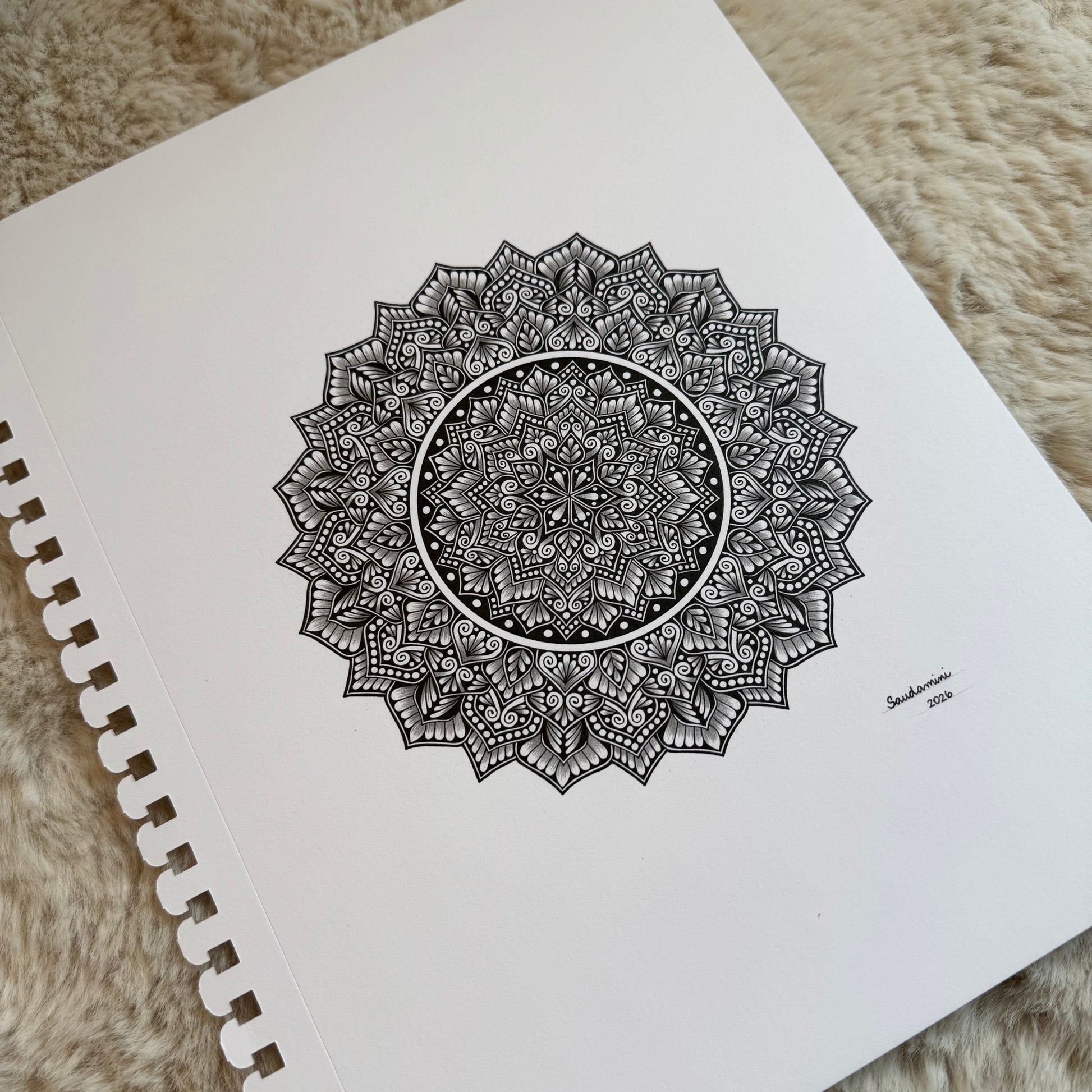 Hand-drawn mandala by Saudamini Madra in black ink on Bristol paper, detail view of serrated outer edge and crosshatching