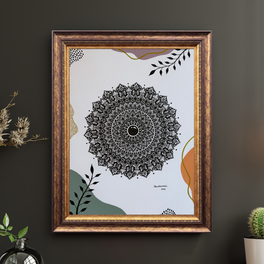 Framed mandala art on a dark wall with decorative elements.